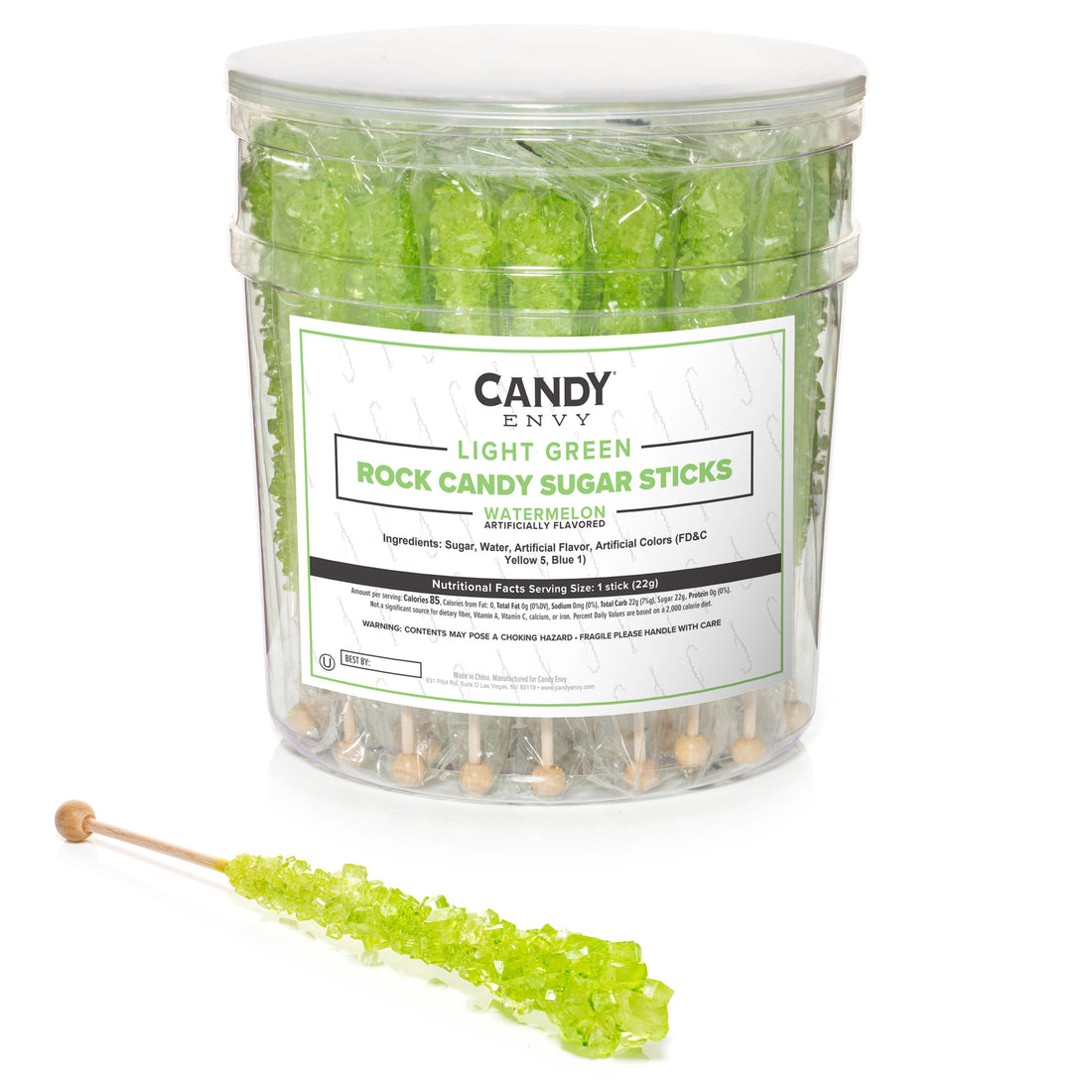 A clear plastic tub of Candy Envy Light Green Rock Candy Sugar Sticks, with a white label and a single green rock candy stick displayed in front on a white background.