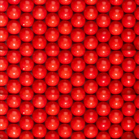 Close-up of a large number of red gumballs.